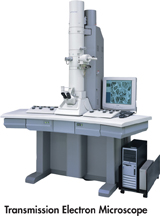 A researcher working with a transmission electron microscope.