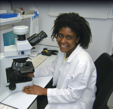 A photograph of Dr. Tanasa Osborne working in the laboratory.