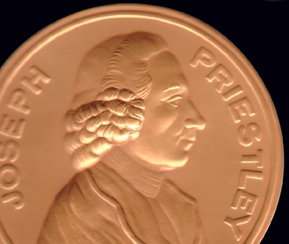 Joseph Priestley's face embedded on a coin.