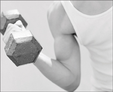 A man flexing his arm with a dumbbell.