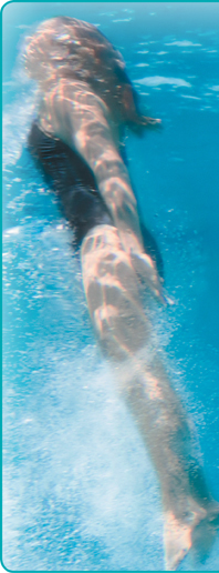 A photograph of a girl swimming under water.