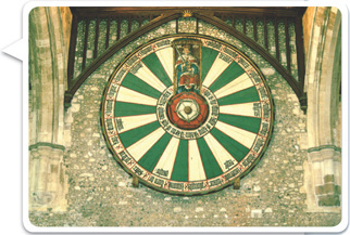 A round table is divided into 26 equal wedges, with King Arthur occupying two of them.