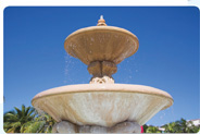 A fountain consists of two disk shapes, the bottom larger than the top.