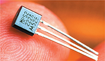 A transistor with three lines connected at the top by a square metal cube. 