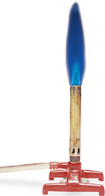 A burner heats with a blue flame.
