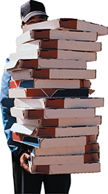 A man carrying a stack of pizza boxes piled high.