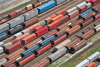An aerial view of rows of  railroad box cars.