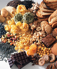 Various starchy foods, including pasta, chocolate, and grains.