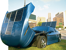 Photo of a car with solar panels on its hood and trunk.