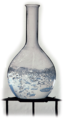A glass vial containing a boiling liquid.