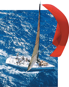 Photo of an aerial view of a sailboat on water, depicting how velocity changes as the sailboat changes directions.