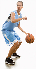 Photo of a basketball player bouncing a basketball.