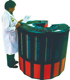 A large supercomputer that is almost the same height as the physicist who stands near it reading the data.  This supercomputer is used to study particles.