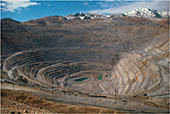 A  large circular canyon, rocks in layers that resemble stadium seating.