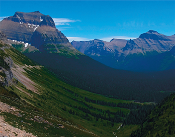 A  U-shaped valley in the mountains that was created by a glacier.