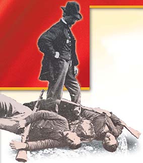 A man standing over dead soldiers.