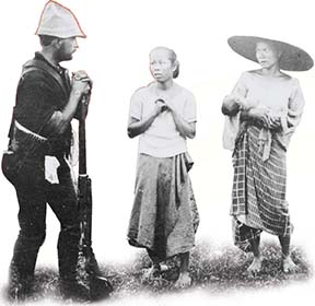 A photo of an American soldier and two Filipino women.