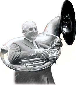A photo of President Warren G. Harding playing a tuba.