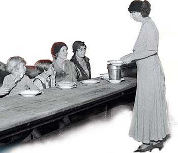A photo of Eleanor Roosevelt serving food to women and children.