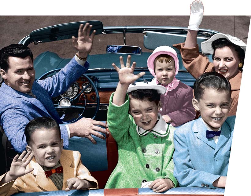 A photo of a happy family waving from their convertible.
