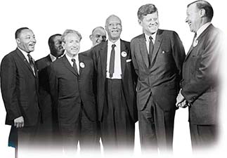 A photograph of President Kennedy standing with civil rights and labor leaders; Martin Luther King, Jr. is in attendance. 