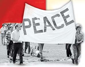 Antiwar protestors march holding a banner that says 'Peace'.