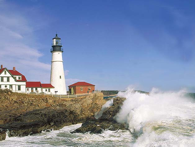 A photo of a lighthouse at the shore.