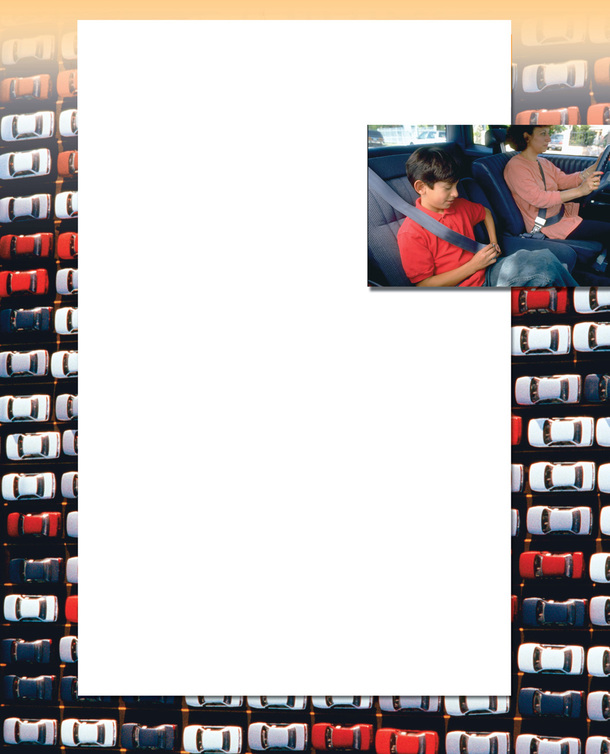 A photo is of a boy fastening his seat belt in front of an aerial photo of rows of cars.